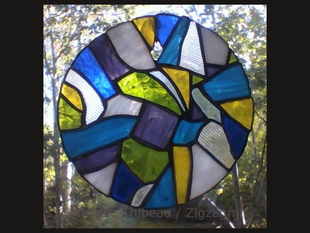 My sister's stained glass work is filled with cool shapes and colours. This piece was created from shards and bits.