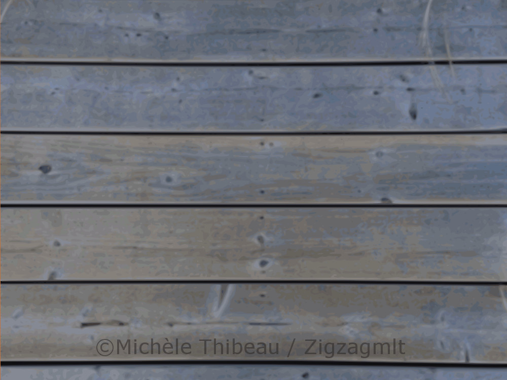 Paspebiac Wharf The bluish planks of the wharf, the walkway at Paspebiac in the region of Gaspé, captured in the light of evening.